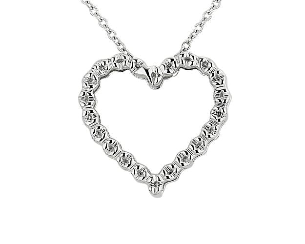 Floating Ruby And Diamond Heart Shaped Pendant
